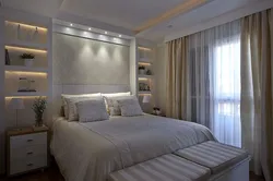 Plasterboard above the bed in the bedroom photo