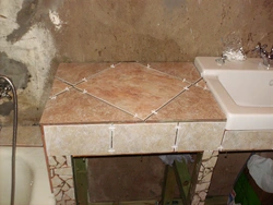 Bathroom cabinet made of tiles photo