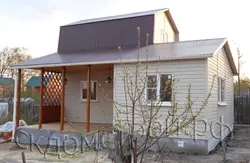 Extension of a bathtub to a wooden house photo