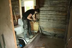 Extension of a bathtub to a wooden house photo