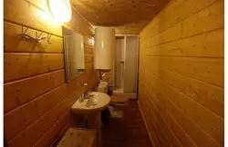 Extension of a bathtub to a wooden house photo