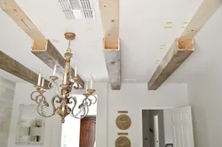 Брус на потолке на кухне фото