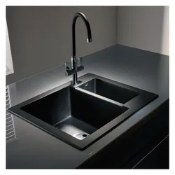Faucet on the countertop in the kitchen photo