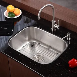 Faucet on the countertop in the kitchen photo