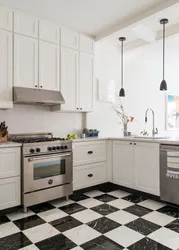 Black and white tiles kitchen floor photo