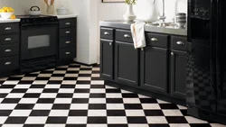 Black and white tiles kitchen floor photo