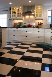 Black and white tiles kitchen floor photo