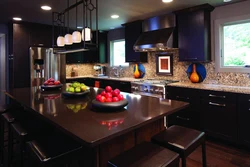 Black Kitchen With Brown Countertop Photo