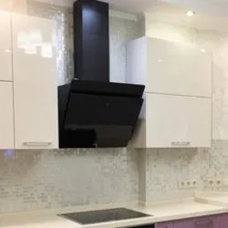 Black inclined hoods in the kitchen photo
