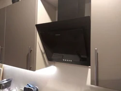 Black inclined hoods in the kitchen photo