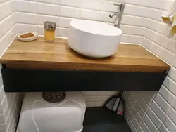 Wooden countertop in the bathroom photo design