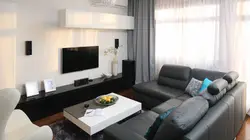 Living room with only a sofa and TV photo