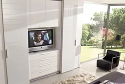 Chest of drawers and cabinets in one living room photo