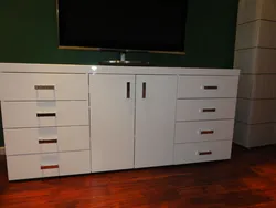 Chest of drawers and cabinets in one living room photo
