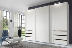 White wardrobe with mirror in the bedroom photo