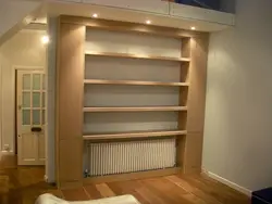 Built-in shelves in the wall in the bedroom photo