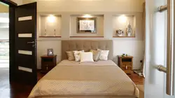 Built-in shelves in the wall in the bedroom photo