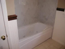 Bathtub made of marbled PVC panels photo