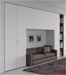 Wardrobes and sofas in the living room interior photo