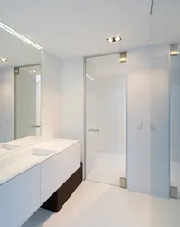Photo on glass in the bathroom and toilet