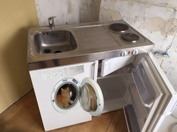 Refrigerator washing machine sink in the kitchen photo