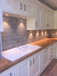 Apron and countertop in the kitchen tiles photo