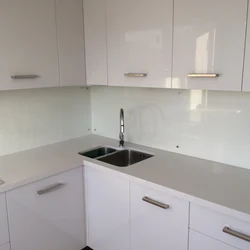 If the kitchen is glossy and the apron is matte photo