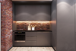 Photo of a kitchen without handles in loft style