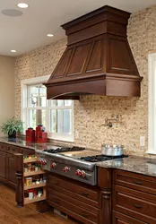 Kitchen hood in a wooden house photo