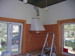 Kitchen hood in a wooden house photo