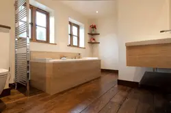 Tiles on wooden floor in bathroom photo