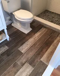 Tiles on wooden floor in bathroom photo