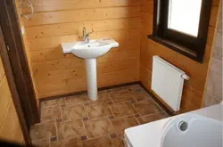 Tiles on wooden floor in bathroom photo