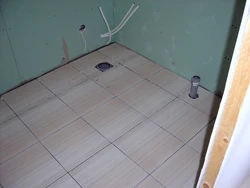Tiles on wooden floor in bathroom photo