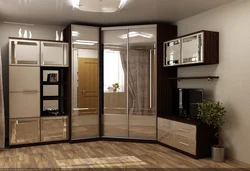 Corner wardrobe in the bedroom with TV photo