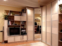 Corner wardrobe in the bedroom with TV photo