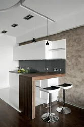 Kitchen with bar counter and TV photo