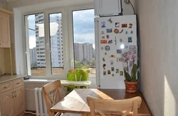 Refrigerator by the balcony door in the kitchen photo