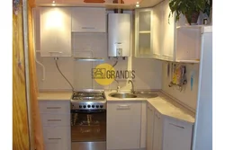 Gas pipe behind the refrigerator in the kitchen photo