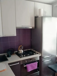 Gas pipe behind the refrigerator in the kitchen photo