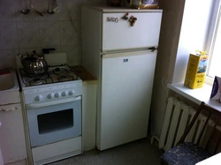 Gas pipe behind the refrigerator in the kitchen photo