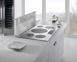 Photo of a kitchen with hob and hood