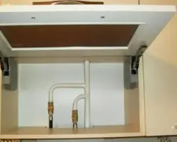 Photo of a gas pipe and hood in the kitchen