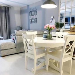 Chairs in the living room photo with a round table