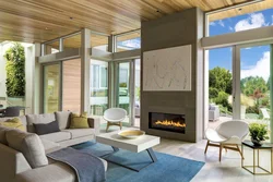 Living room with fireplace and panoramic windows photo