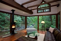 Living room with fireplace and panoramic windows photo