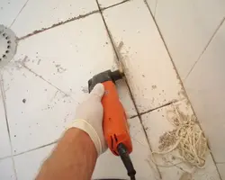 Seams on kitchen floor tiles photo