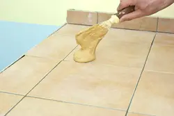 Seams on kitchen floor tiles photo