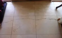 Seams on kitchen floor tiles photo