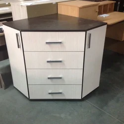Corner chests of drawers in the bedroom for TV photo